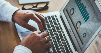 Analytics, Statistics, typing on laptop