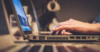 Computer, laptop, side view, typing on laptop