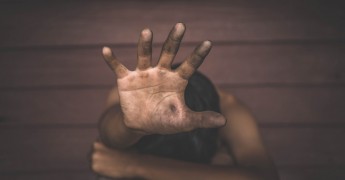 Children sexual abuse, hand over face