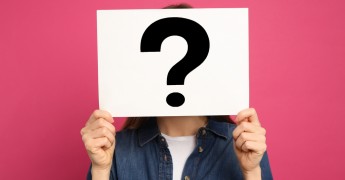Person holding question mark over face, anonymisation, pseudonymisation